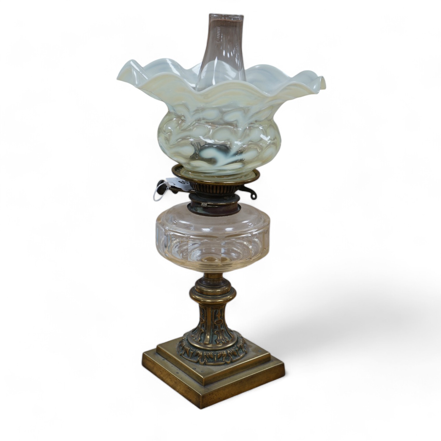 A brass oil lamp with glass reservoir and vaseline glass fluted shade, 48cm high. Condition - good